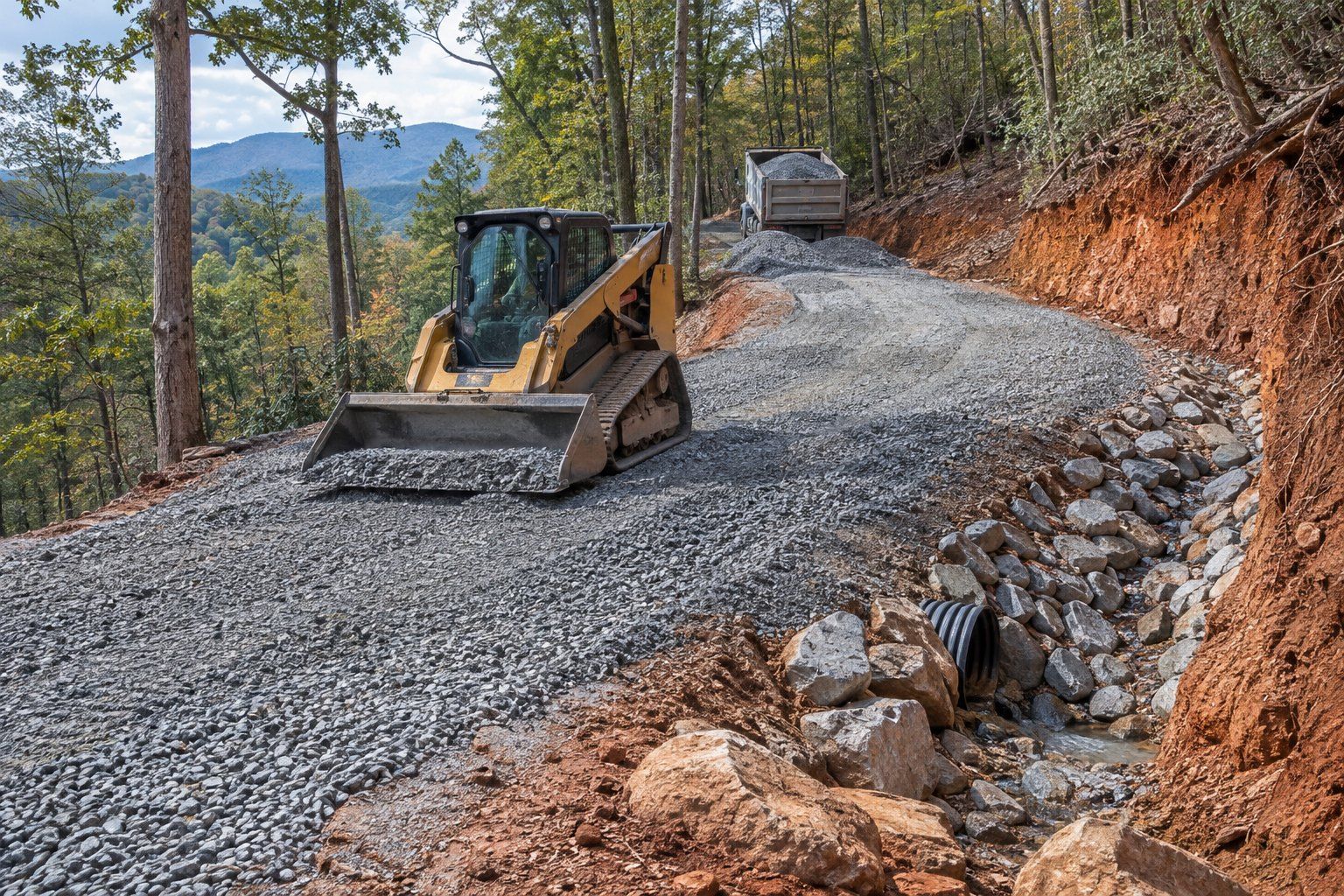 Illustration: a skid steer spreads crushed stone on a new driveway switchback, with a rock-lined ditch and a culvert at the crossing.